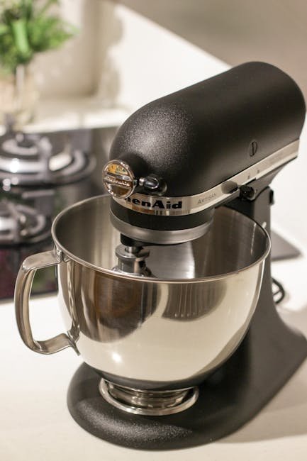 A stylish black kitchen mixer in a modern kitchen setting, perfect for baking needs.